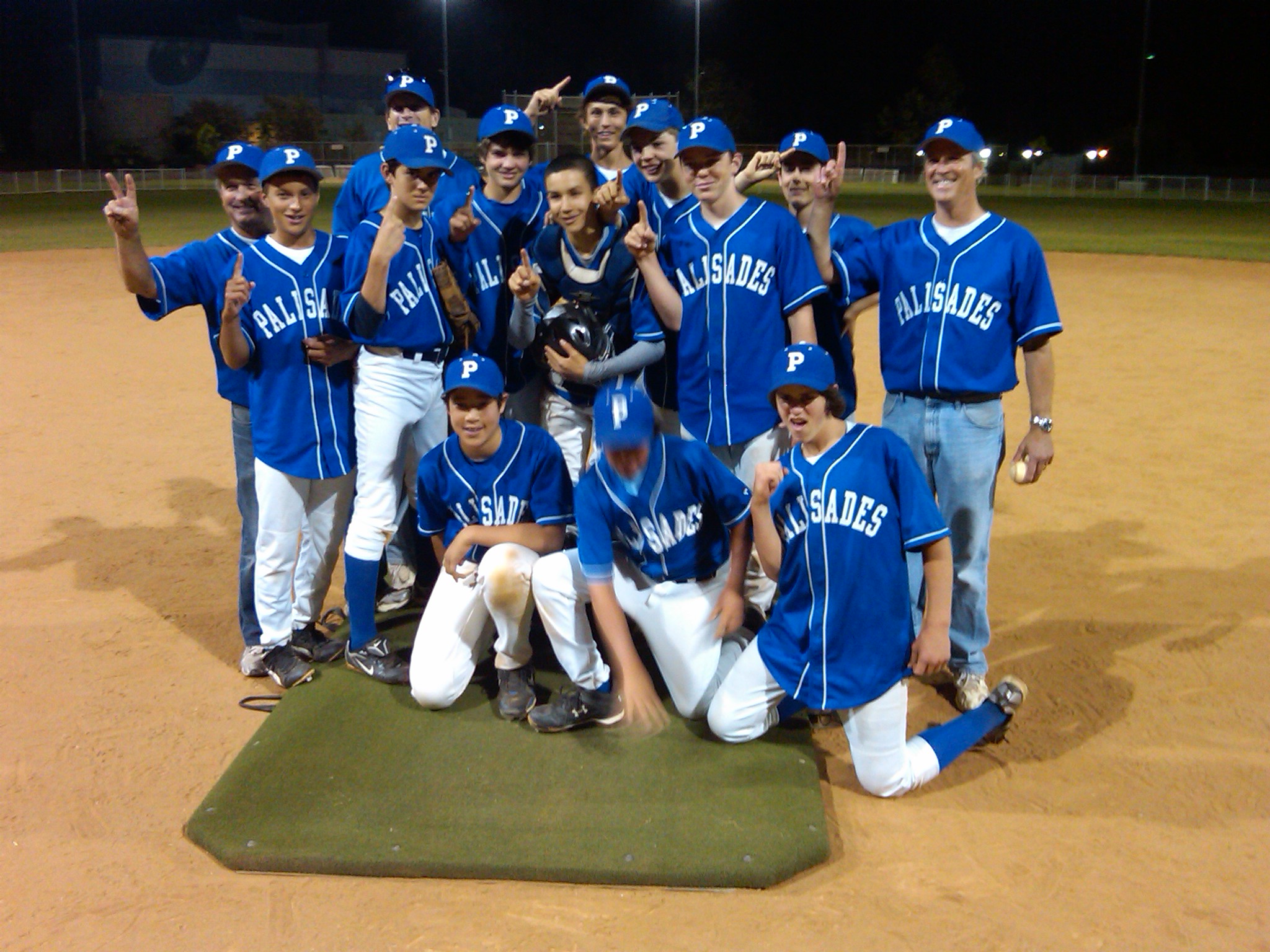 Pali Blue players celebrate their thrilling 11-10 victory in the Pony Division championship game last Friday at the Field of Dreams.